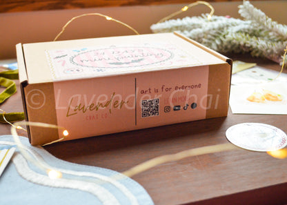 Lavender Chai Co product packaging on a wooden surface with decorative elements.